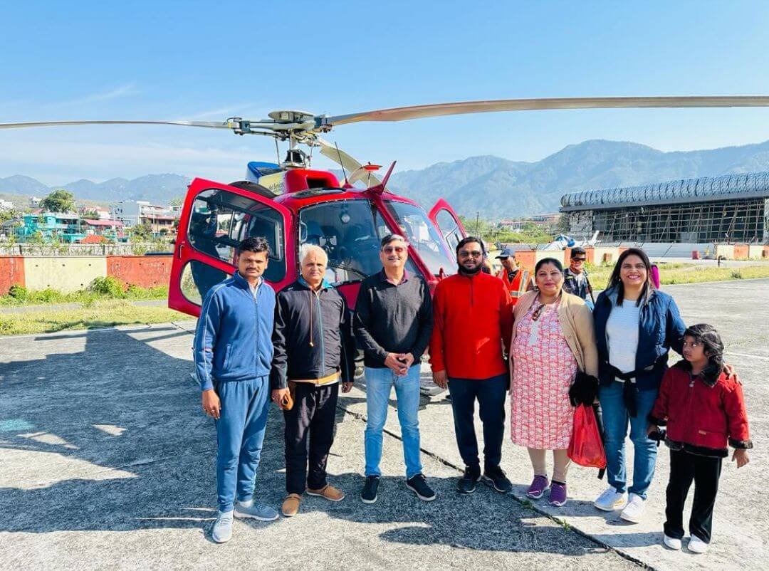 Family group with red helicopter
